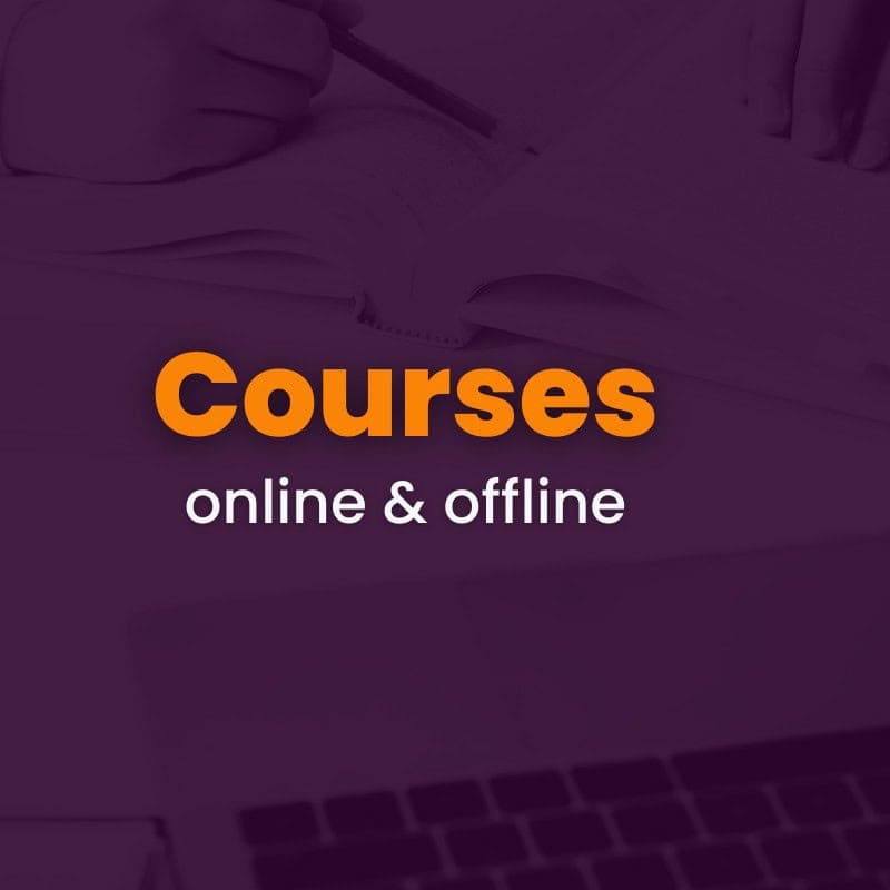 Text "courses online & offline" displayed over a background showing an open book, a hand holding a pen, and part of a laptop keyboard.