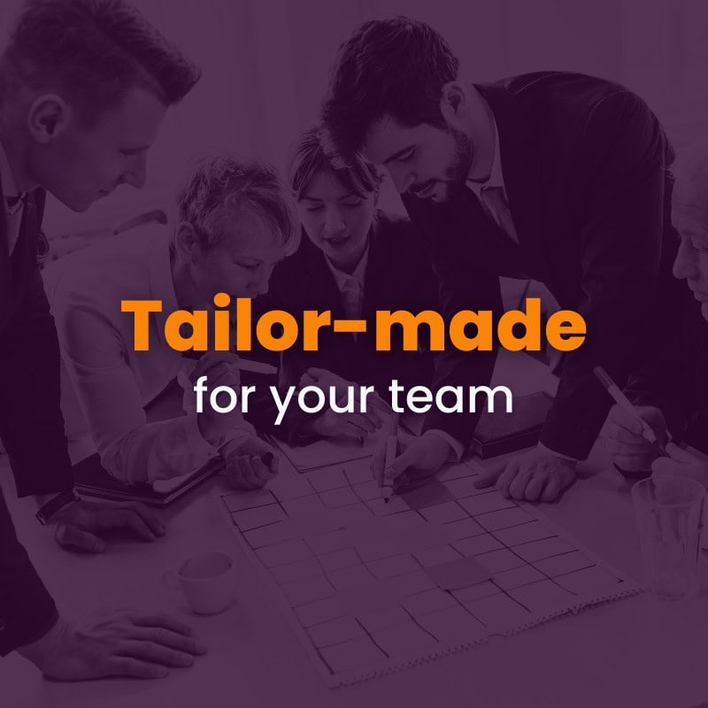 Four people in business attire discuss over a paper grid at a table, with the text "tailor-made for your team" overlayed in the center.